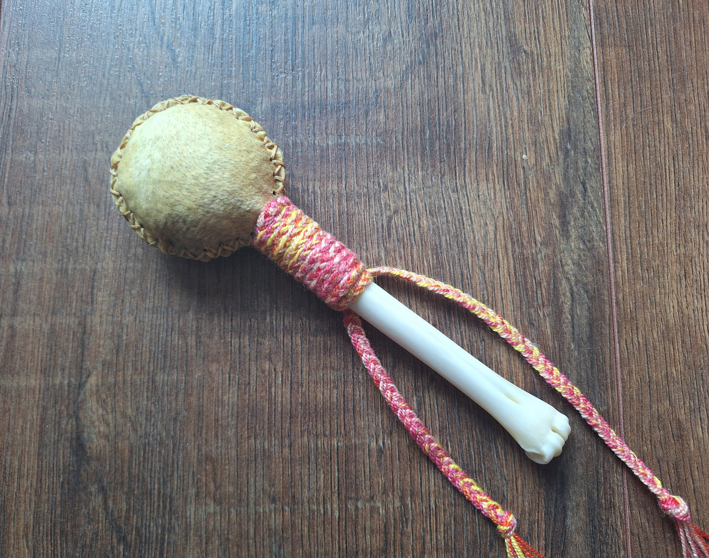 Wild boar hide and roe deer leg bone rattle