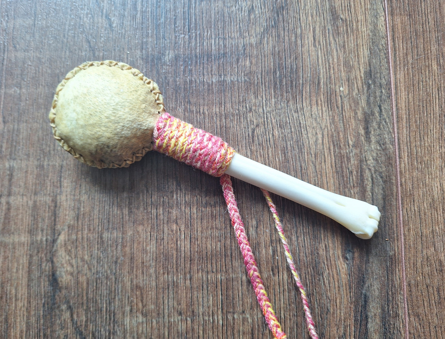 Wild boar hide and roe deer leg bone rattle