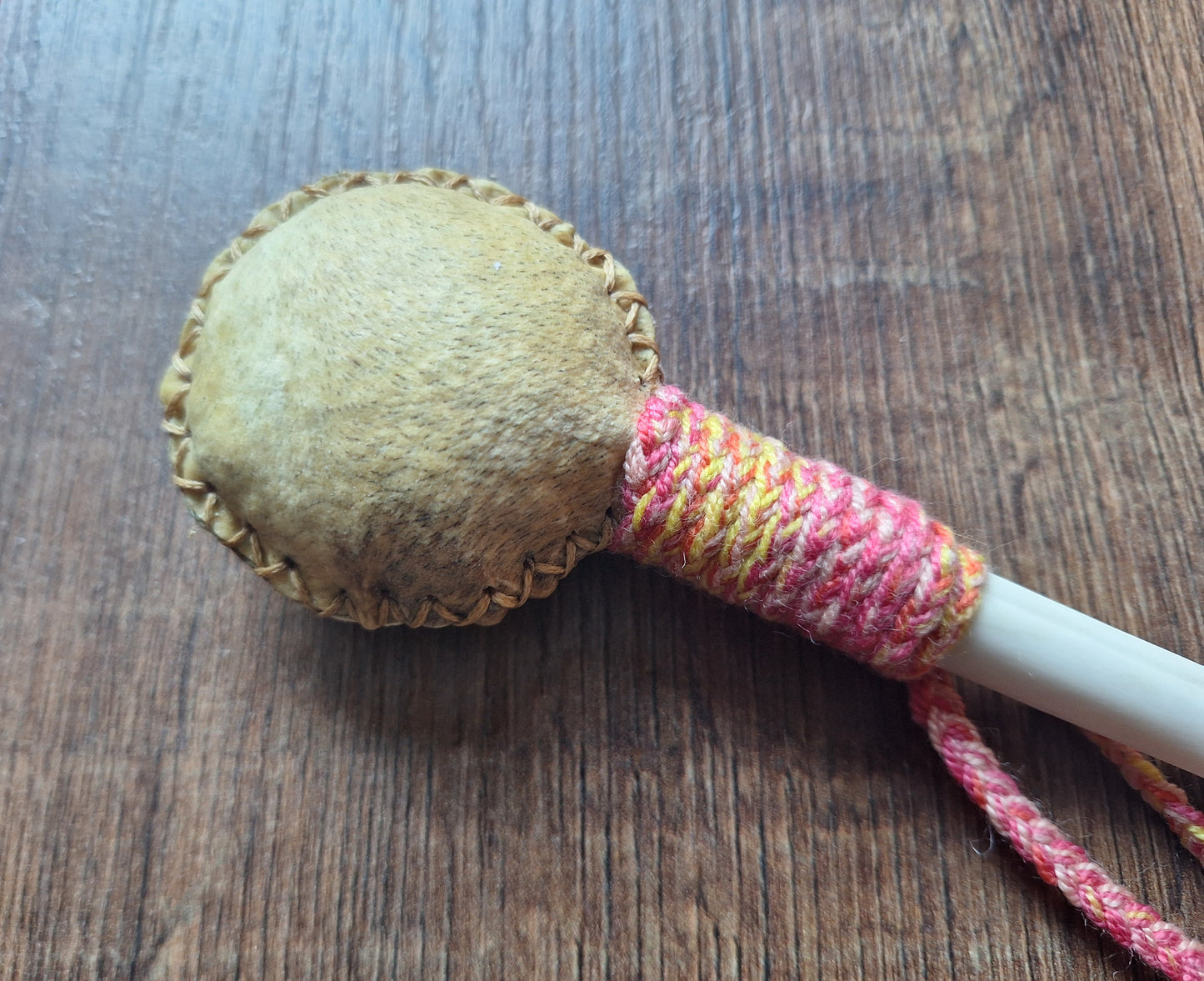 Wild boar hide and roe deer leg bone rattle