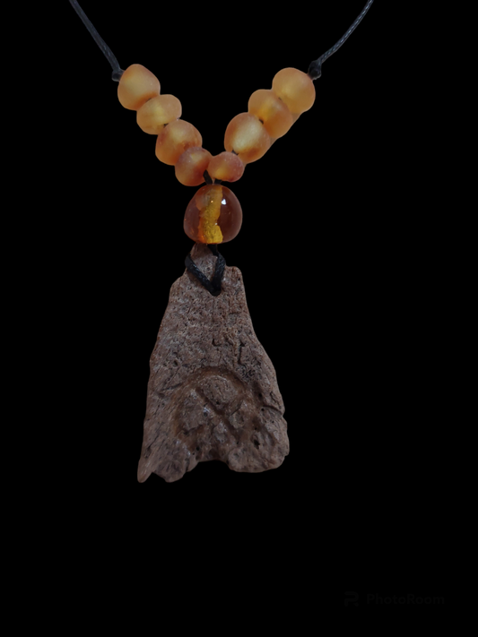 Engraved fossilized bone and amber amulet necklace #1