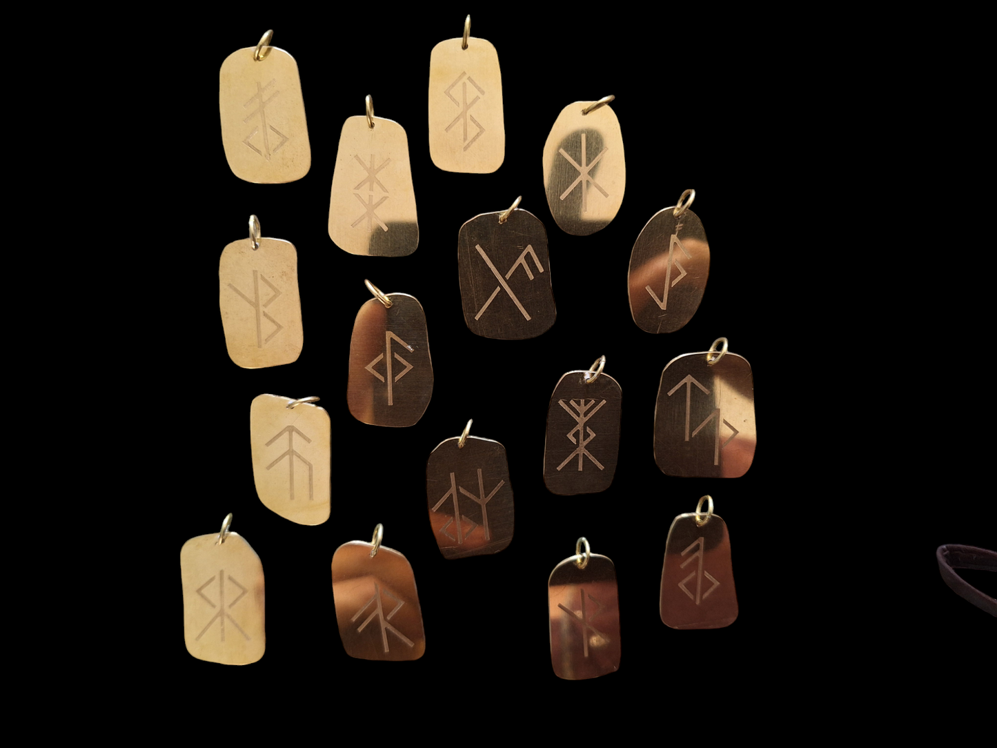 Bind rune pendants by Karak Kam