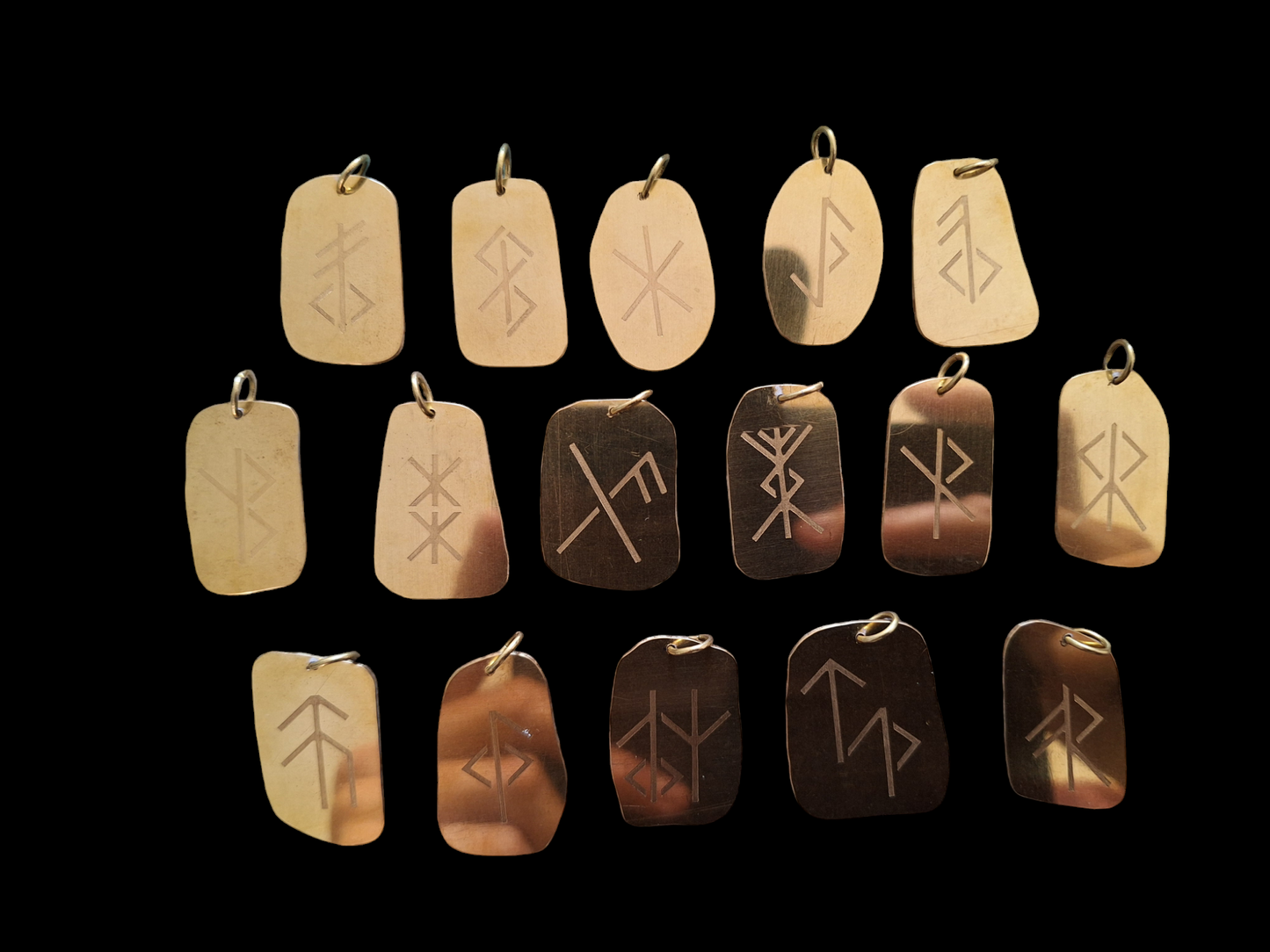 Bind rune pendants by Karak Kam