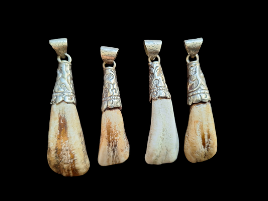 Nepalese yak tooth pendants