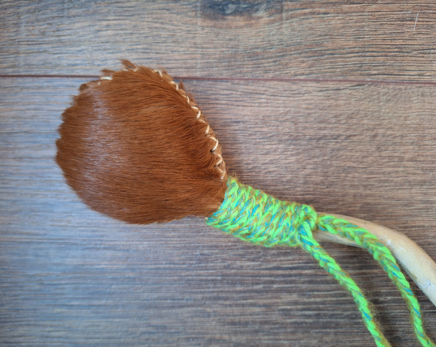 Horse hide and driftwood rattle