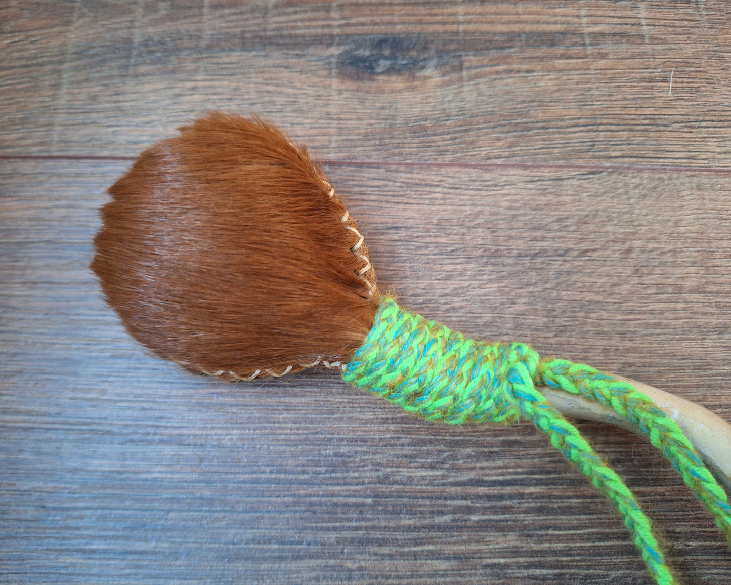 Horse hide and driftwood rattle