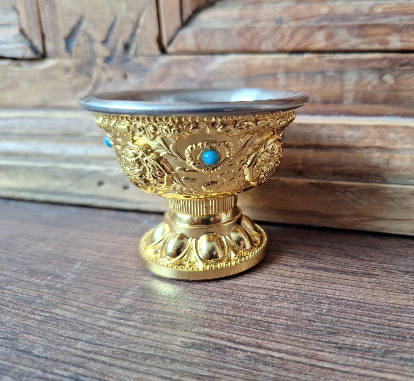 Gold coloured metal alloy offering bowl