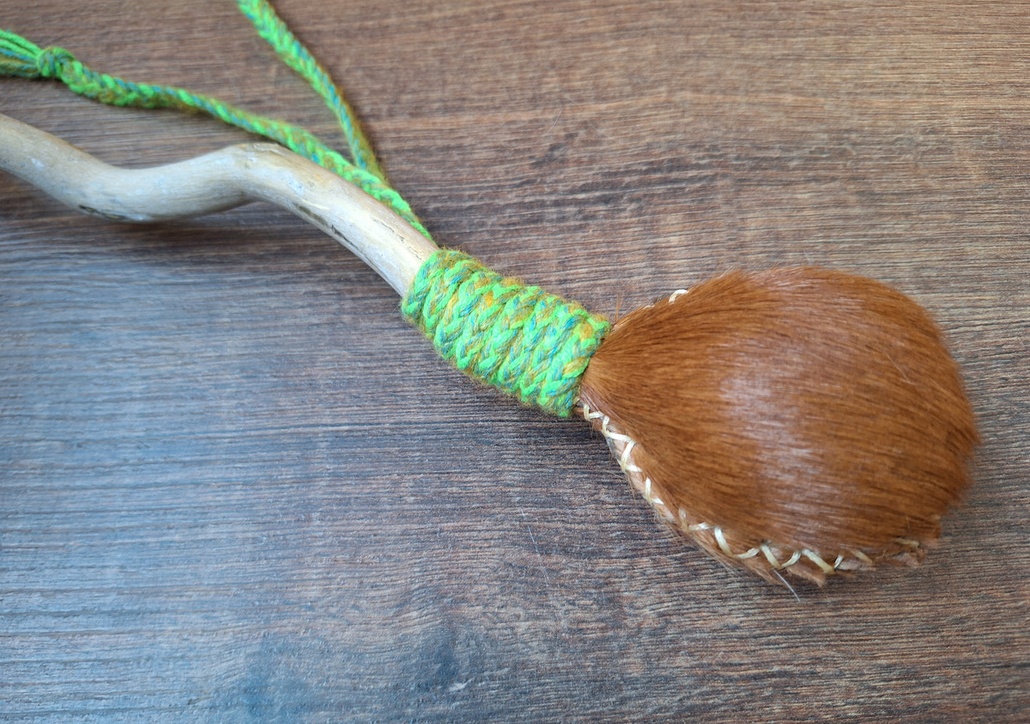 Horse hide and driftwood rattle