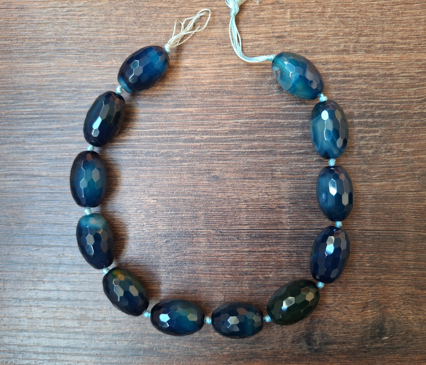 Faceted blue agate bead strand