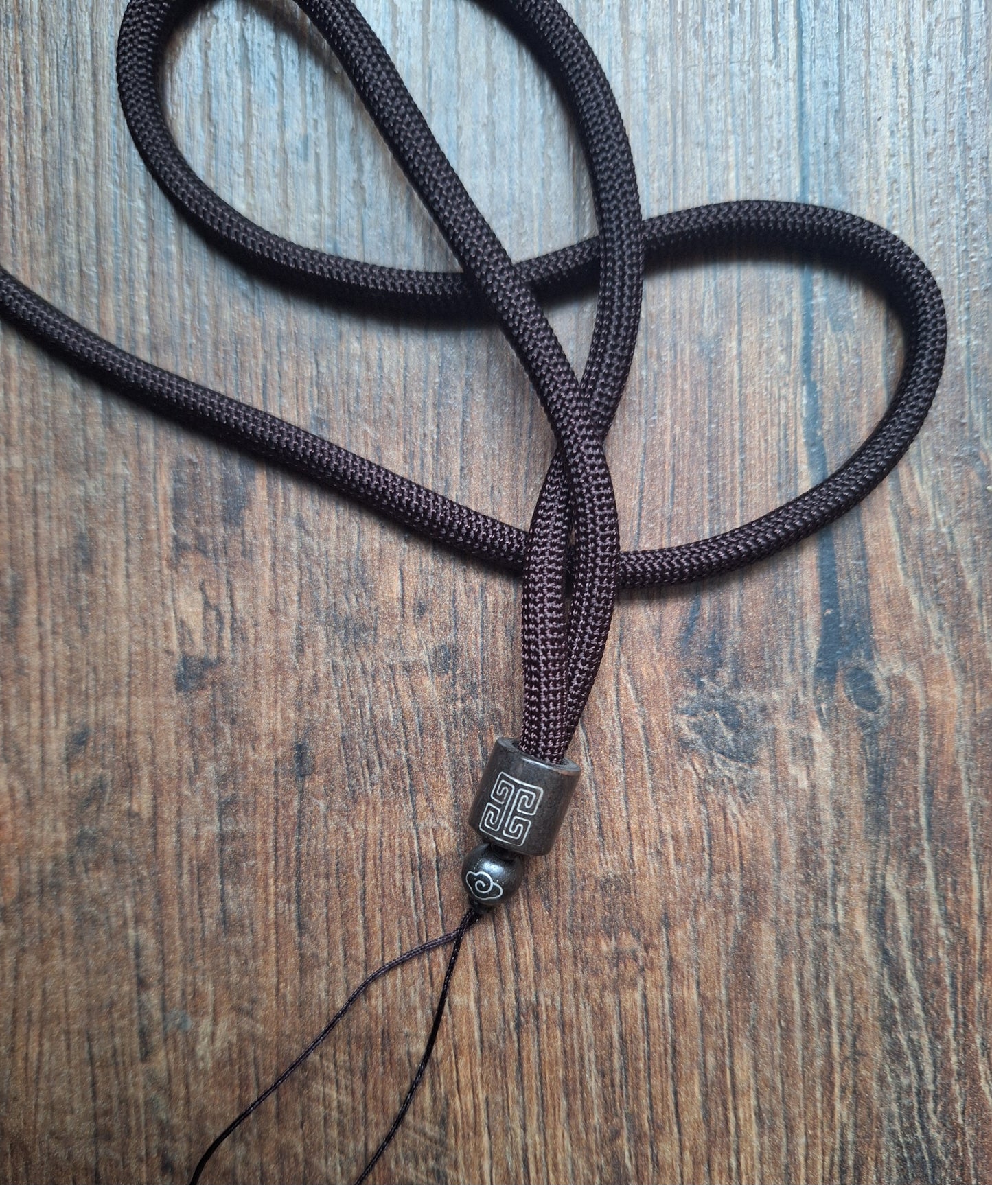 Amulet cord brown with shou symbol