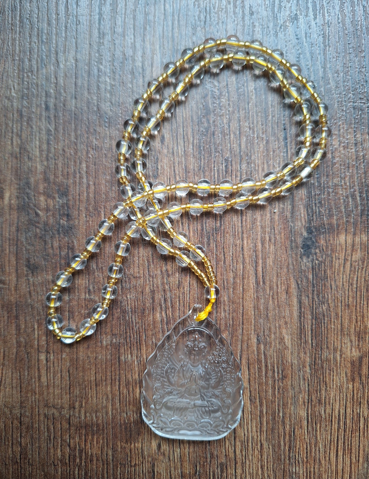 Glass necklace with Guanyin pendant