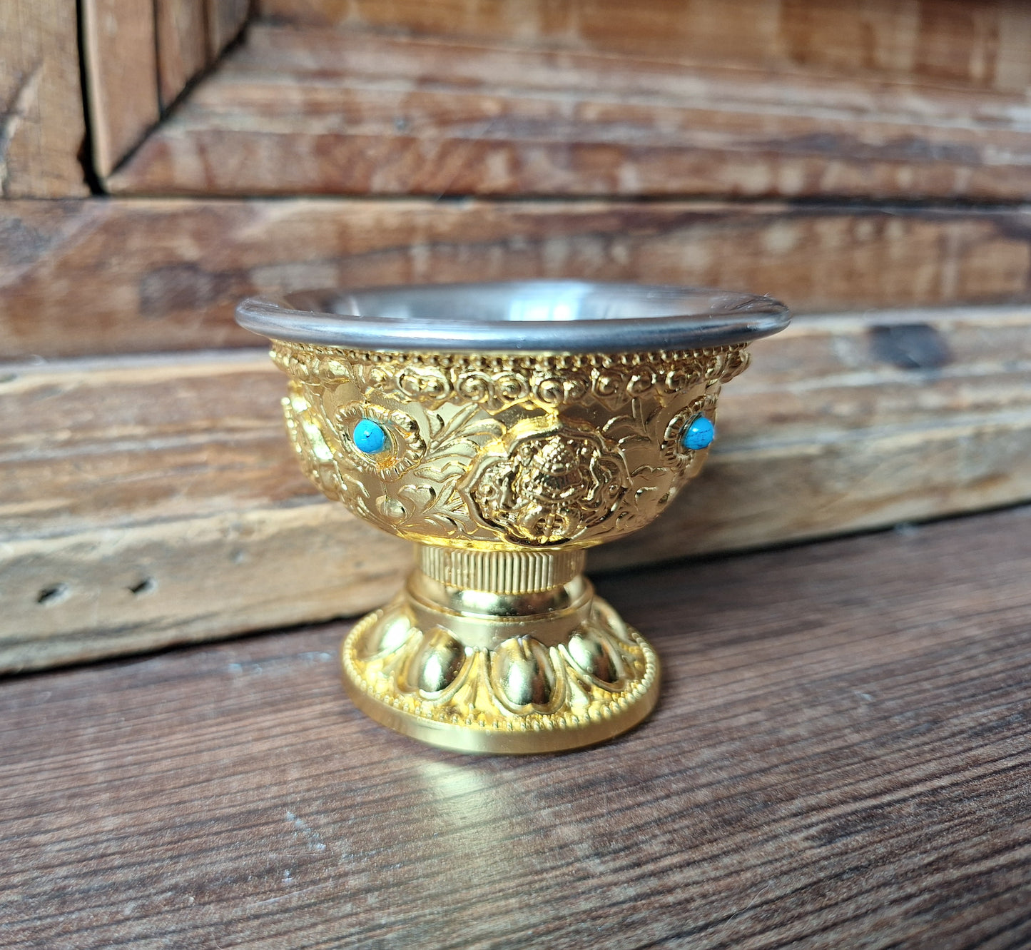 Gold coloured metal alloy offering bowl