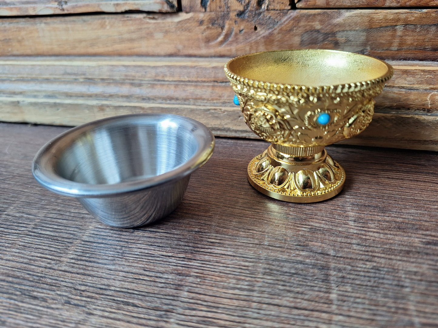 Gold coloured metal alloy offering bowl