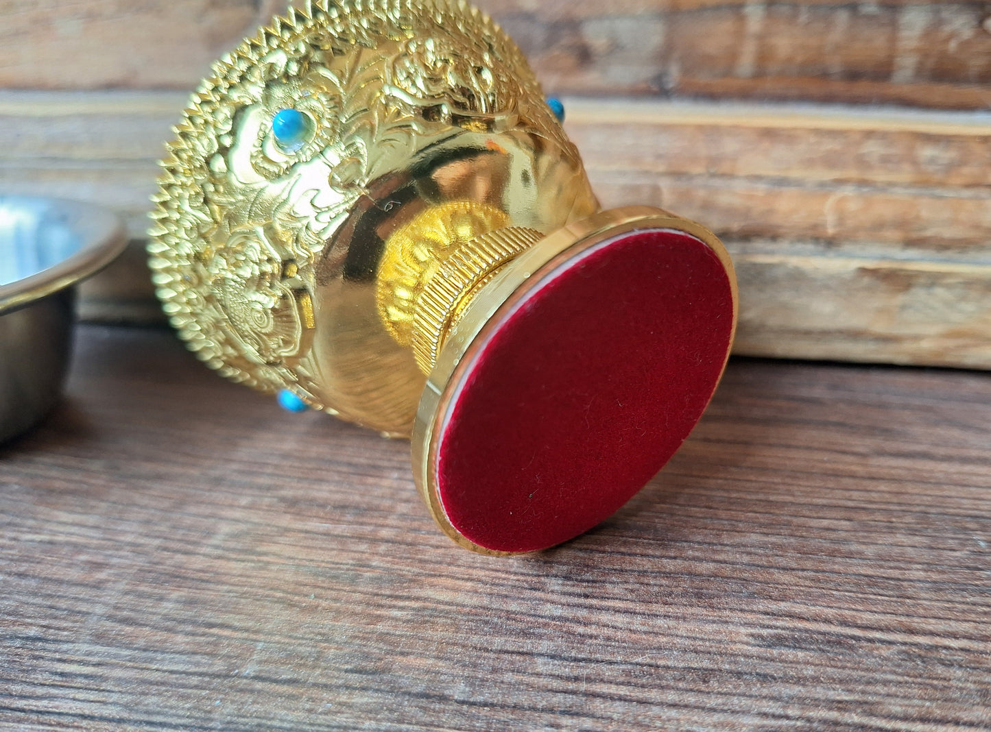 Gold coloured metal alloy offering bowl