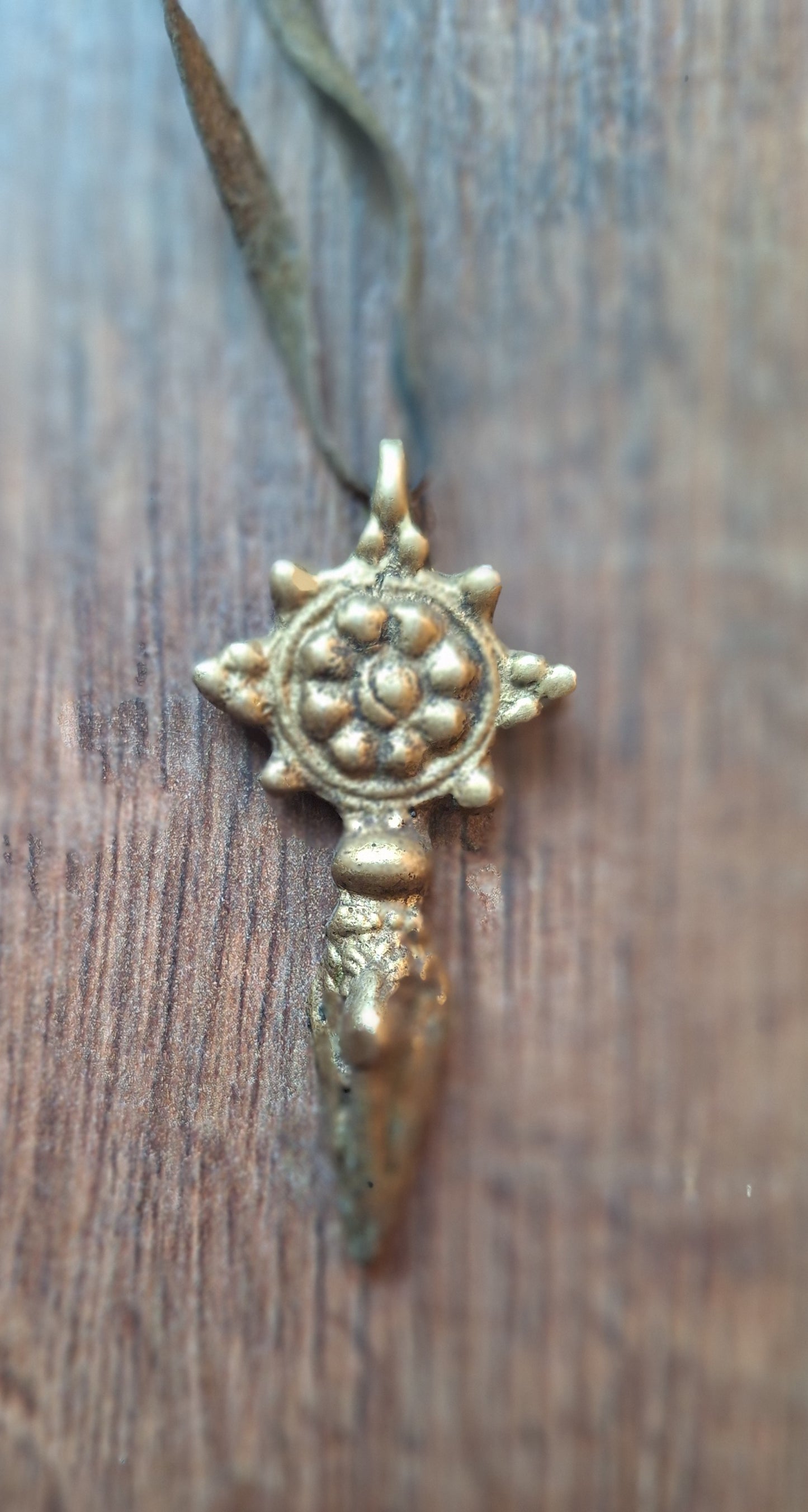 Vintage brass phurba pendant Dharma Wheel