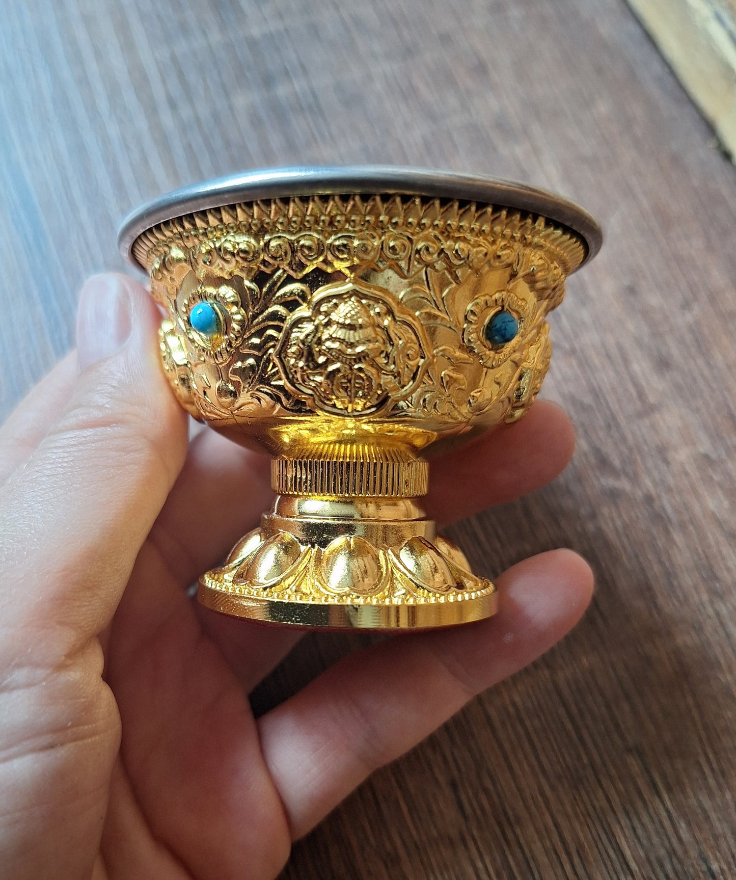 Gold coloured metal alloy offering bowl