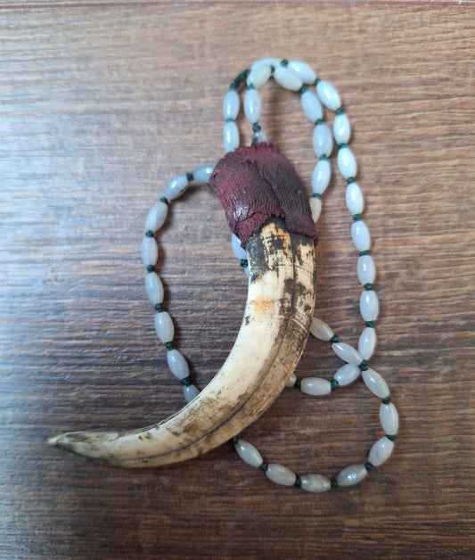 Vintage Nepalese snow quartz necklace with wild boar tooth pendant