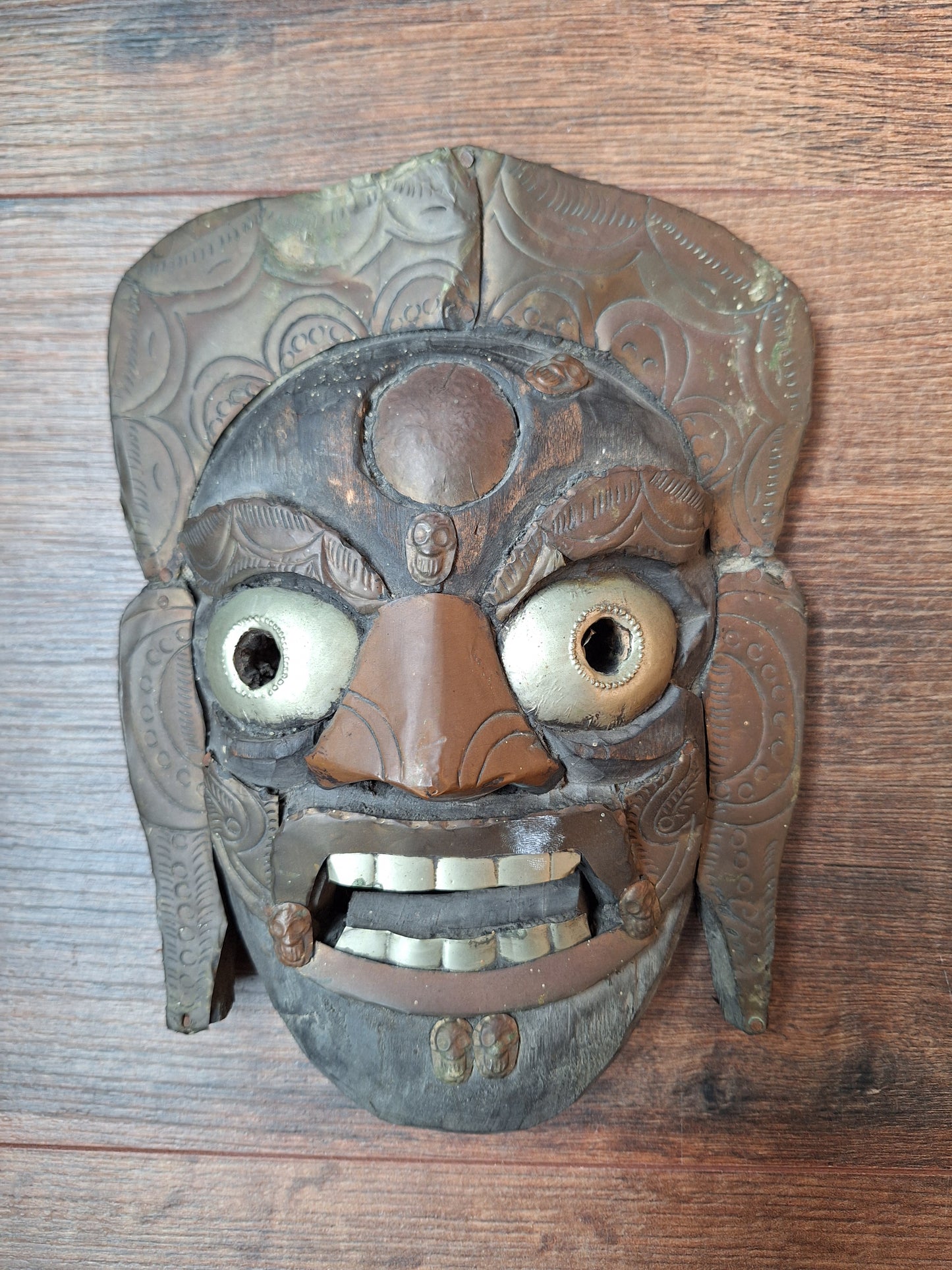 Old wooden Mahakala mask with metal plating