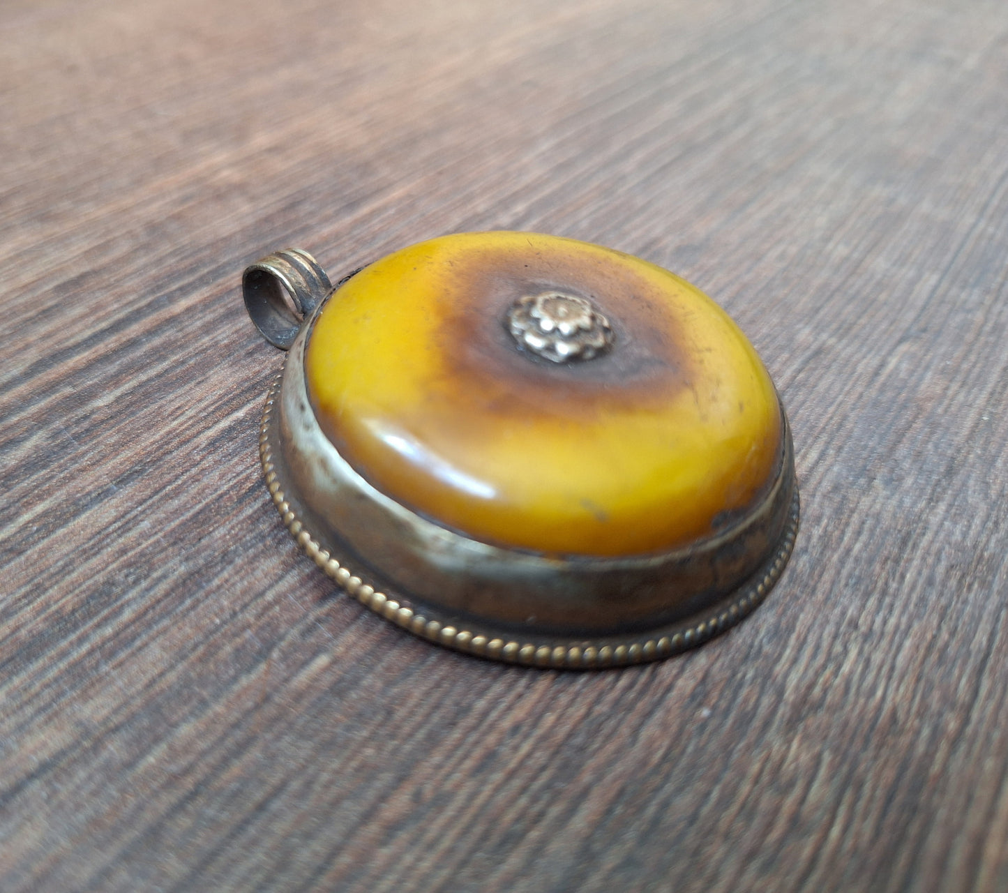 Vintage Tibetan silver and copal pendant