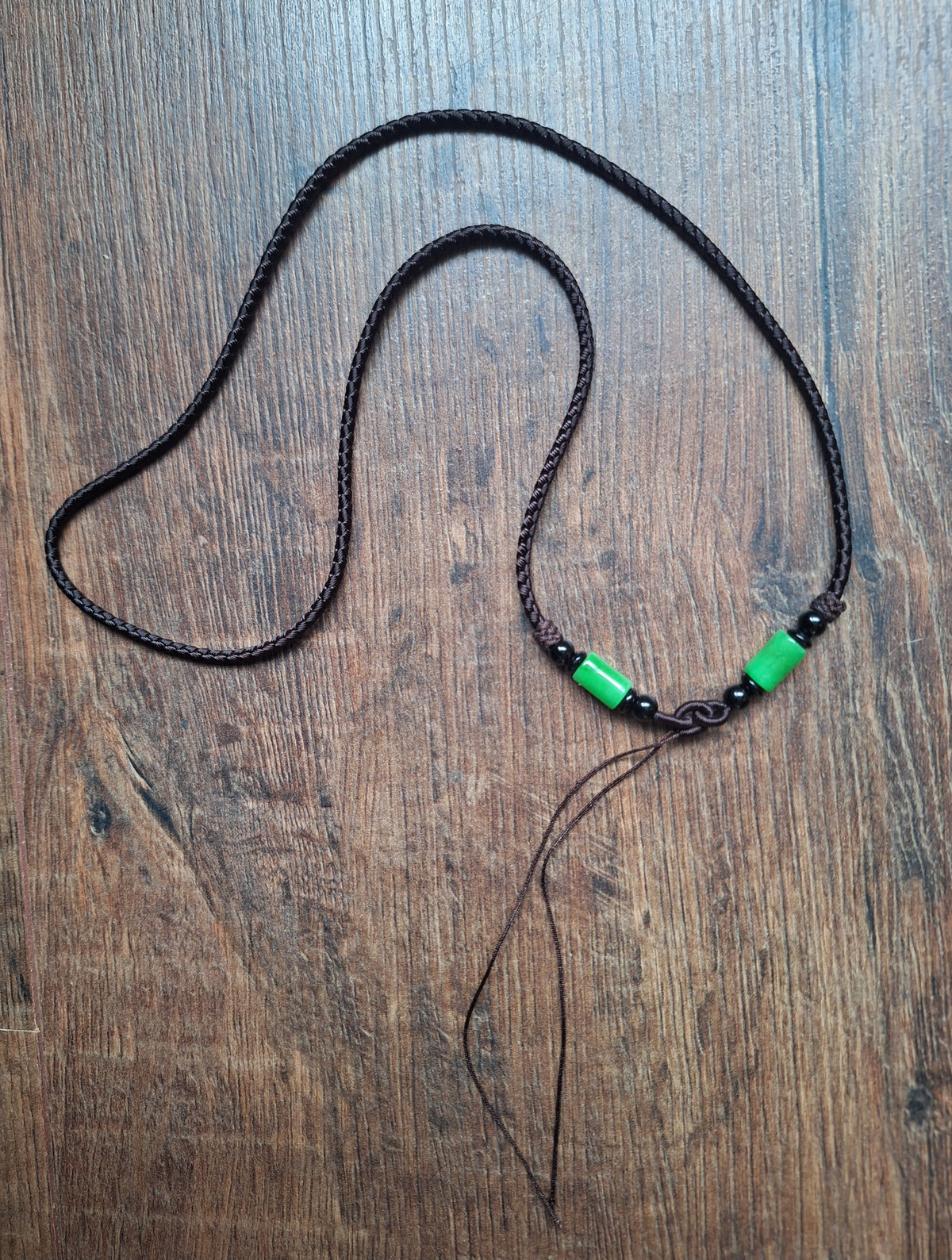 Amulet cord brown with jade beads