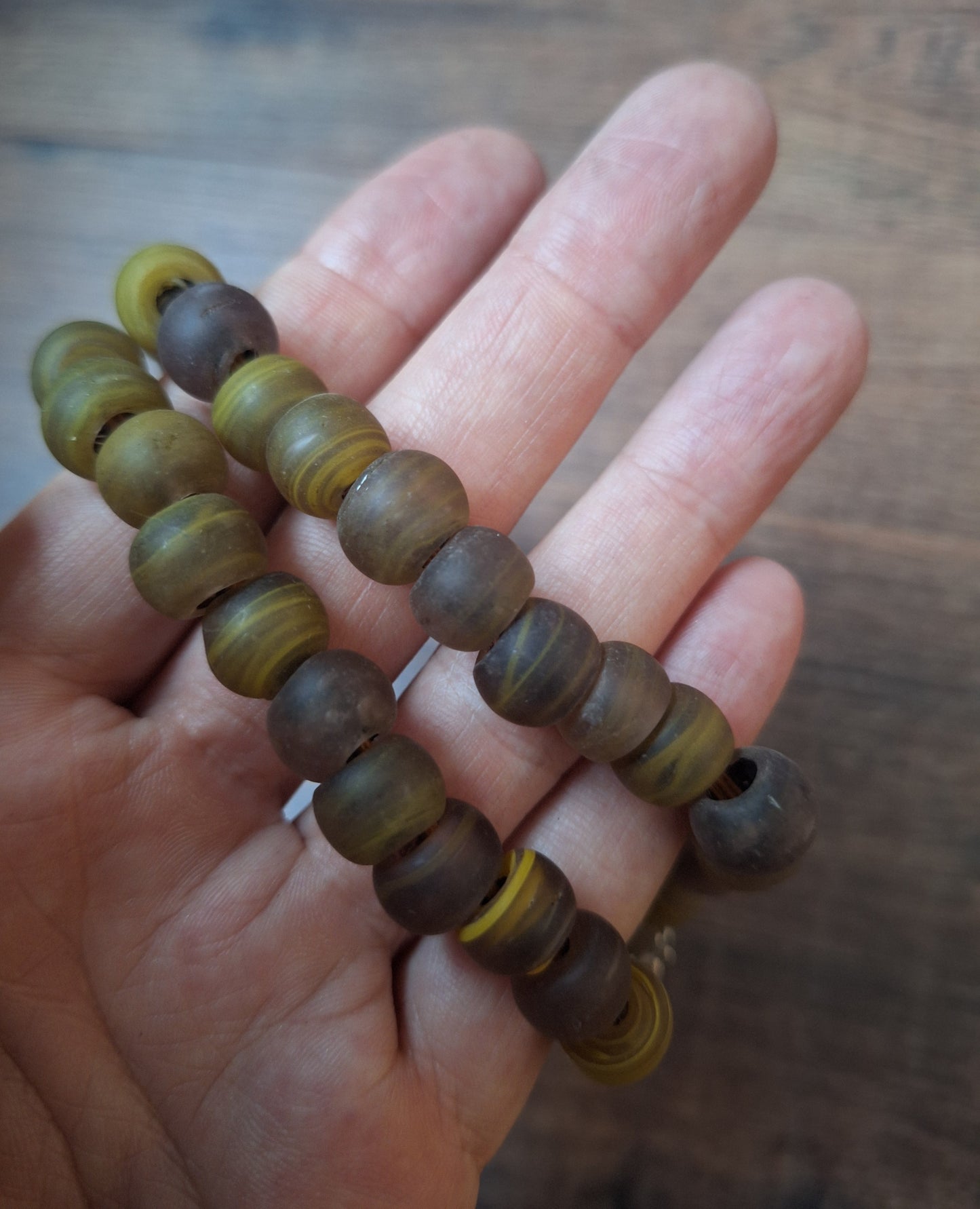 Vintage glass bead necklace with resin tiger tooth pendant