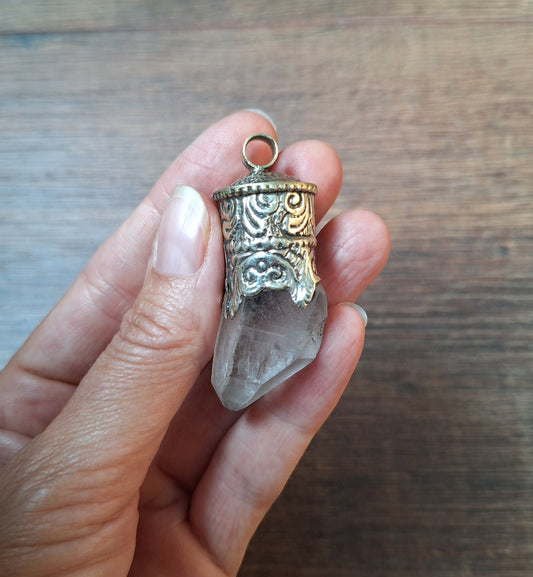 Vintage quartz crystal in Tibetan silver pendant