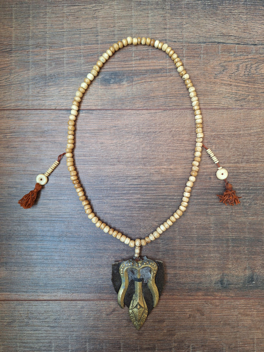 Vintage Tibetan yak bone mala with trident pendant