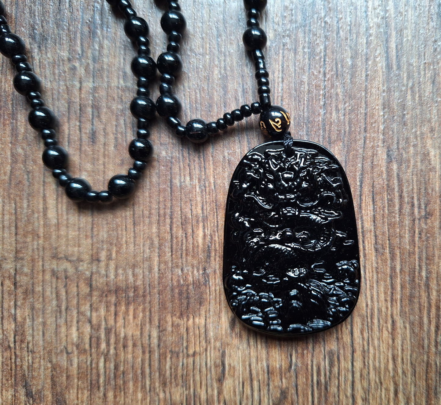 Black glass necklace with Dragon pendant