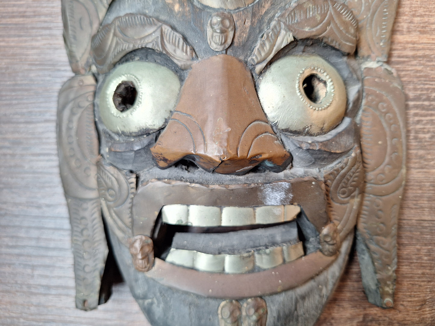 Old wooden Mahakala mask with metal plating