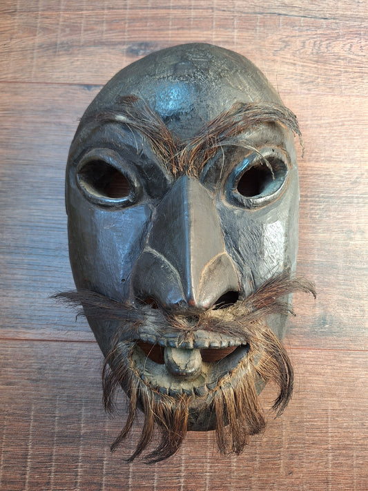 Antique Nepalese wooden mask with yak hair