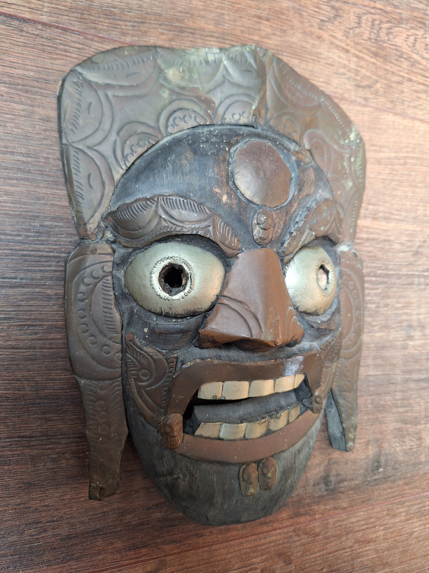 Old wooden Mahakala mask with metal plating