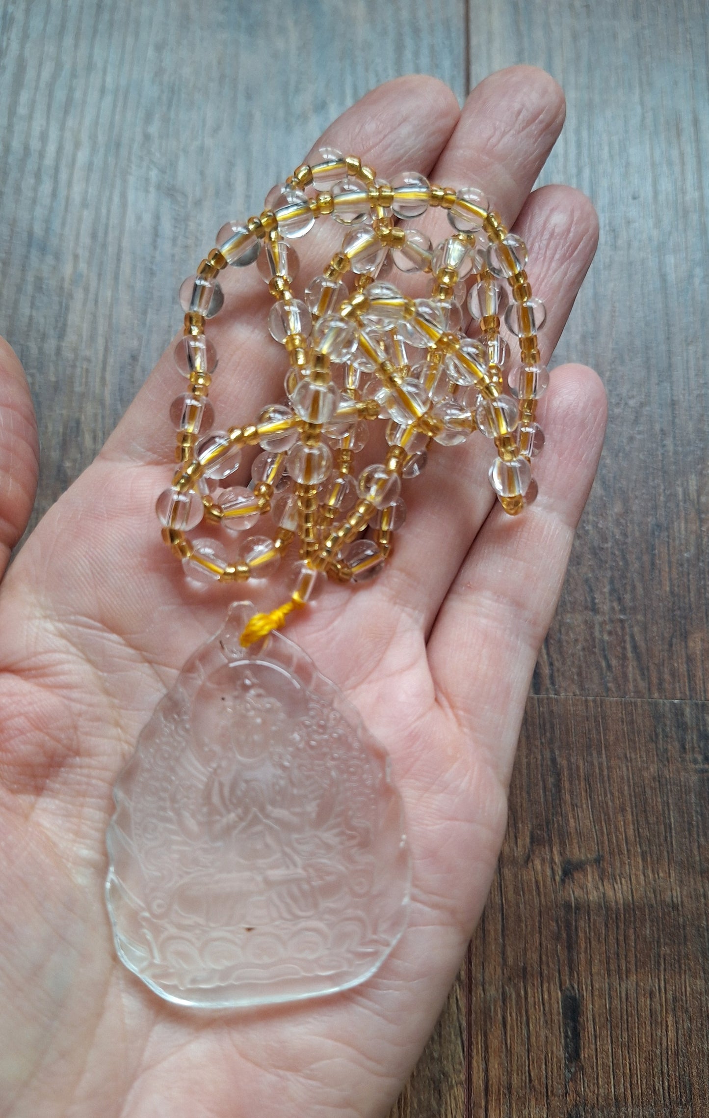 Glass necklace with Guanyin pendant