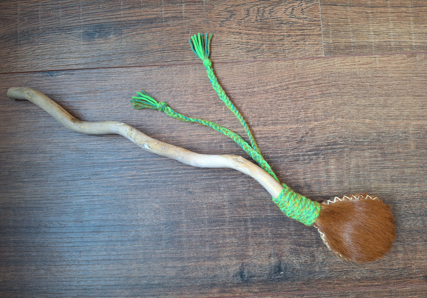 Horse hide and driftwood rattle