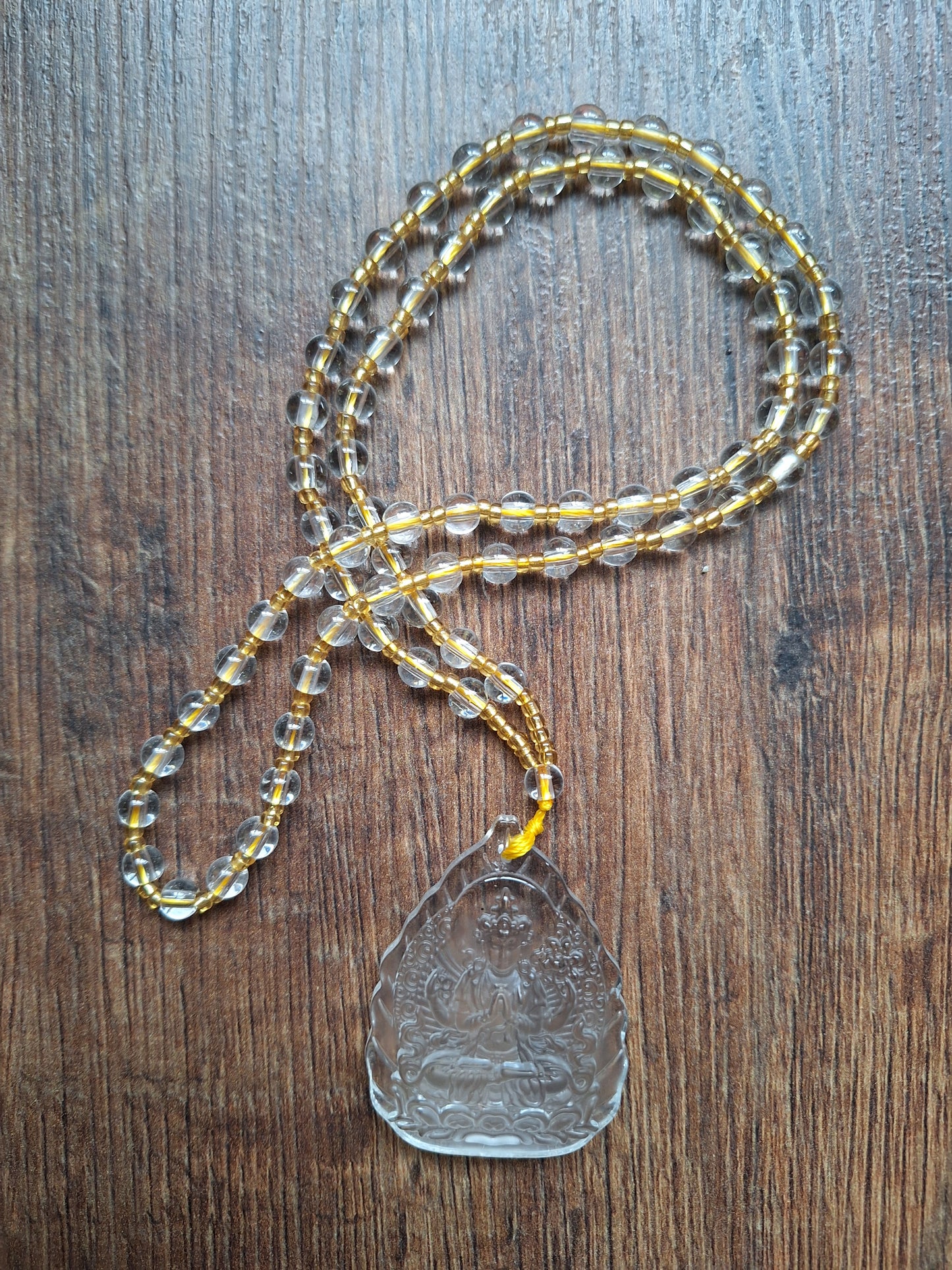 Glass necklace with Guanyin pendant