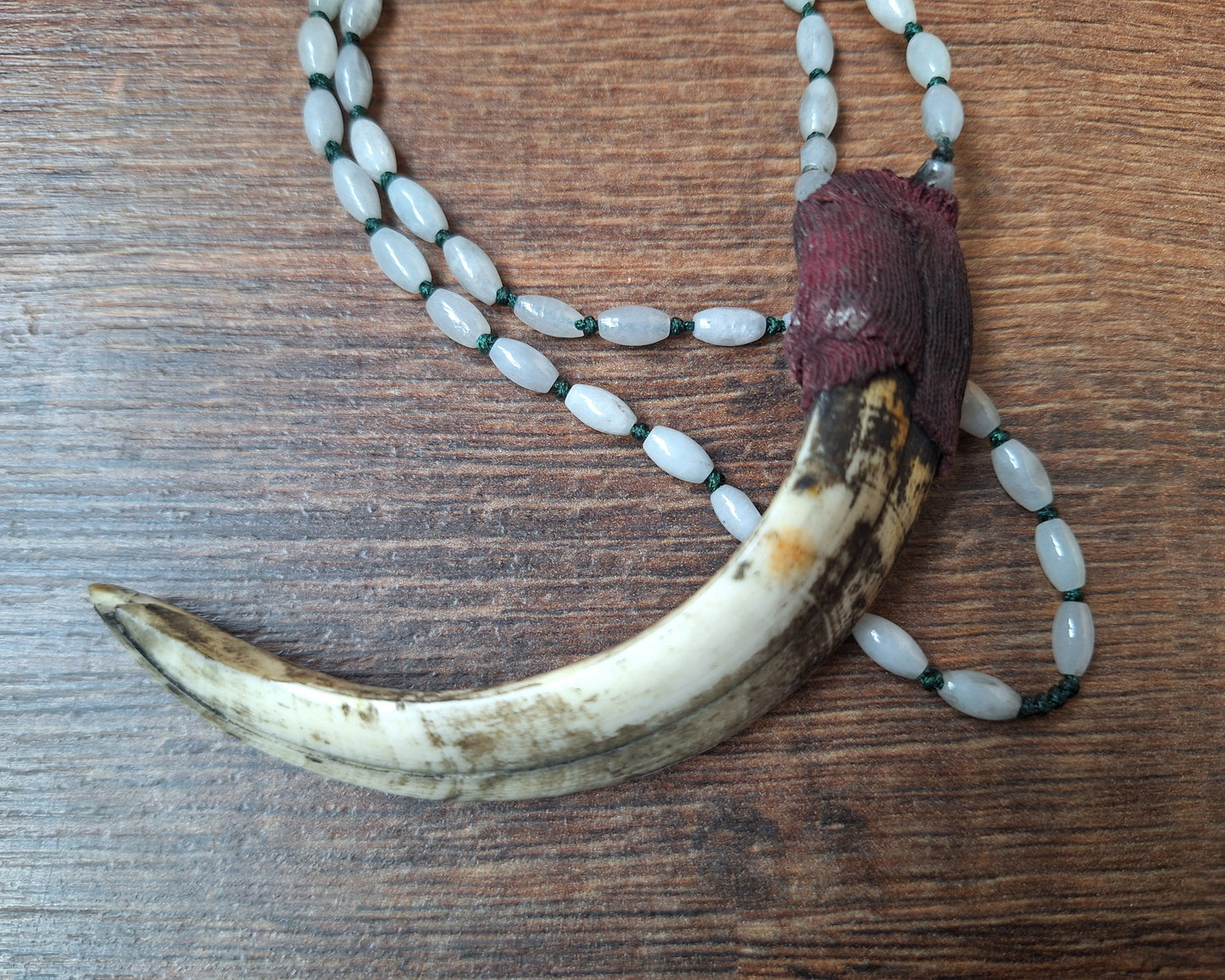 Vintage Nepalese snow quartz necklace with wild boar tooth pendant