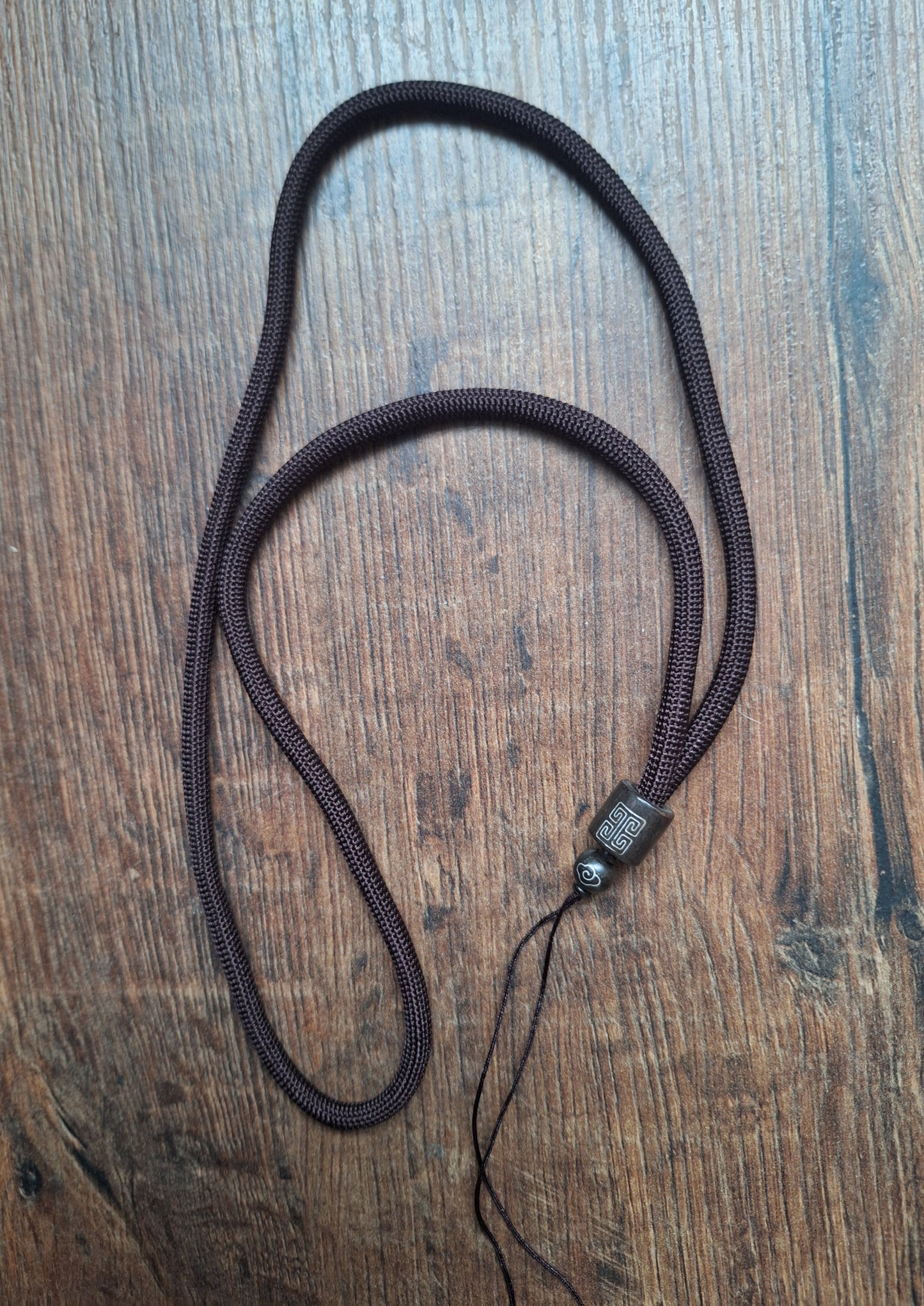 Amulet cord brown with shou symbol