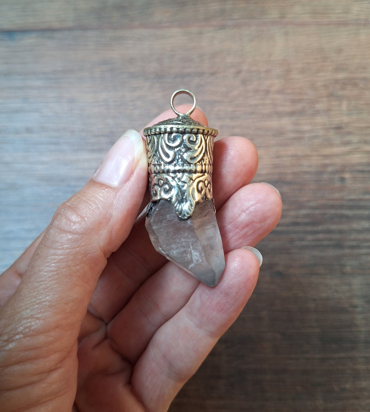 Vintage quartz crystal in Tibetan silver pendant