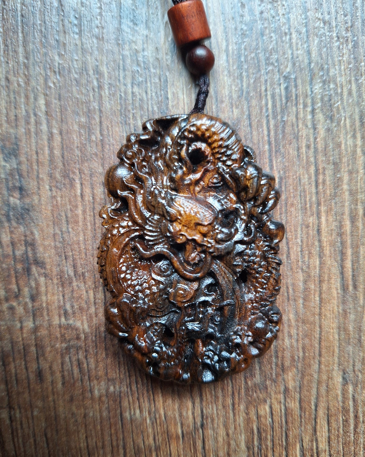 Necklace with wooden pendant Dragon