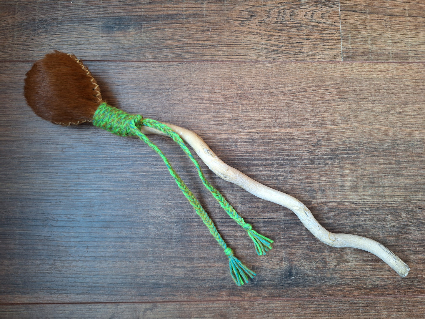 Horse hide and driftwood rattle