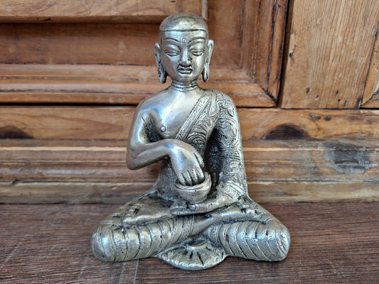 Vintage white metal Shakyamuni Buddha statue