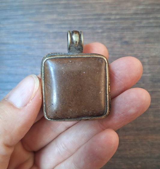 Vintage Tibetan silver and stone pendant