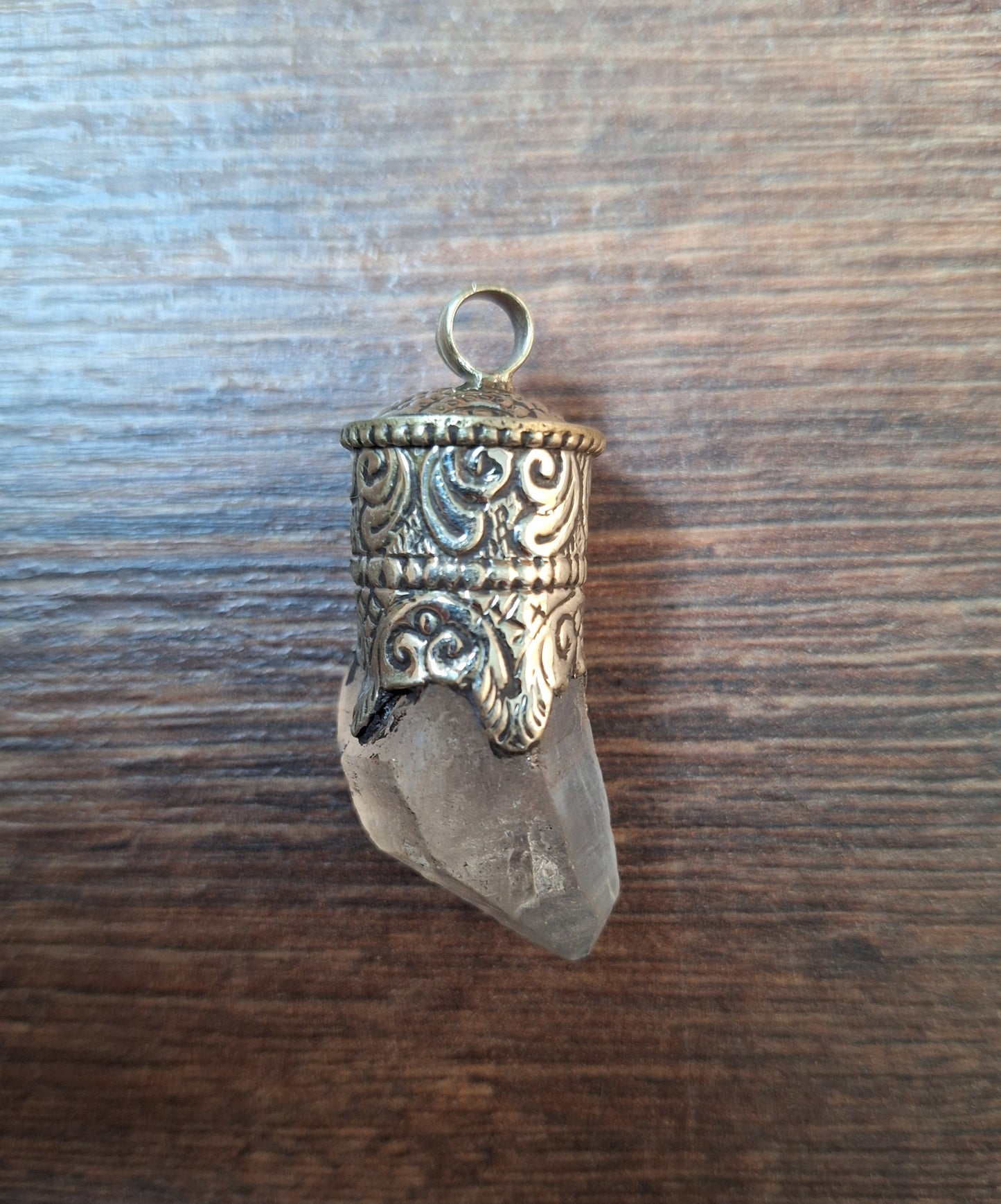 Vintage quartz crystal in Tibetan silver pendant