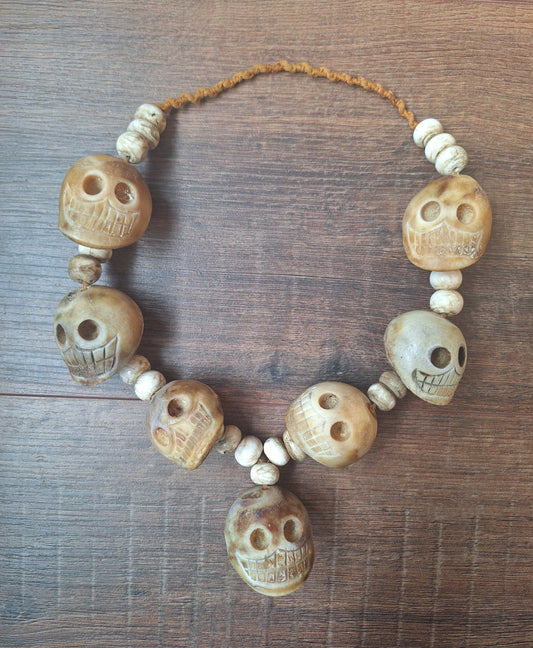 Vintage bone carved skull necklace