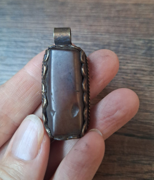 Vintage Tibetan silver and amber pendant