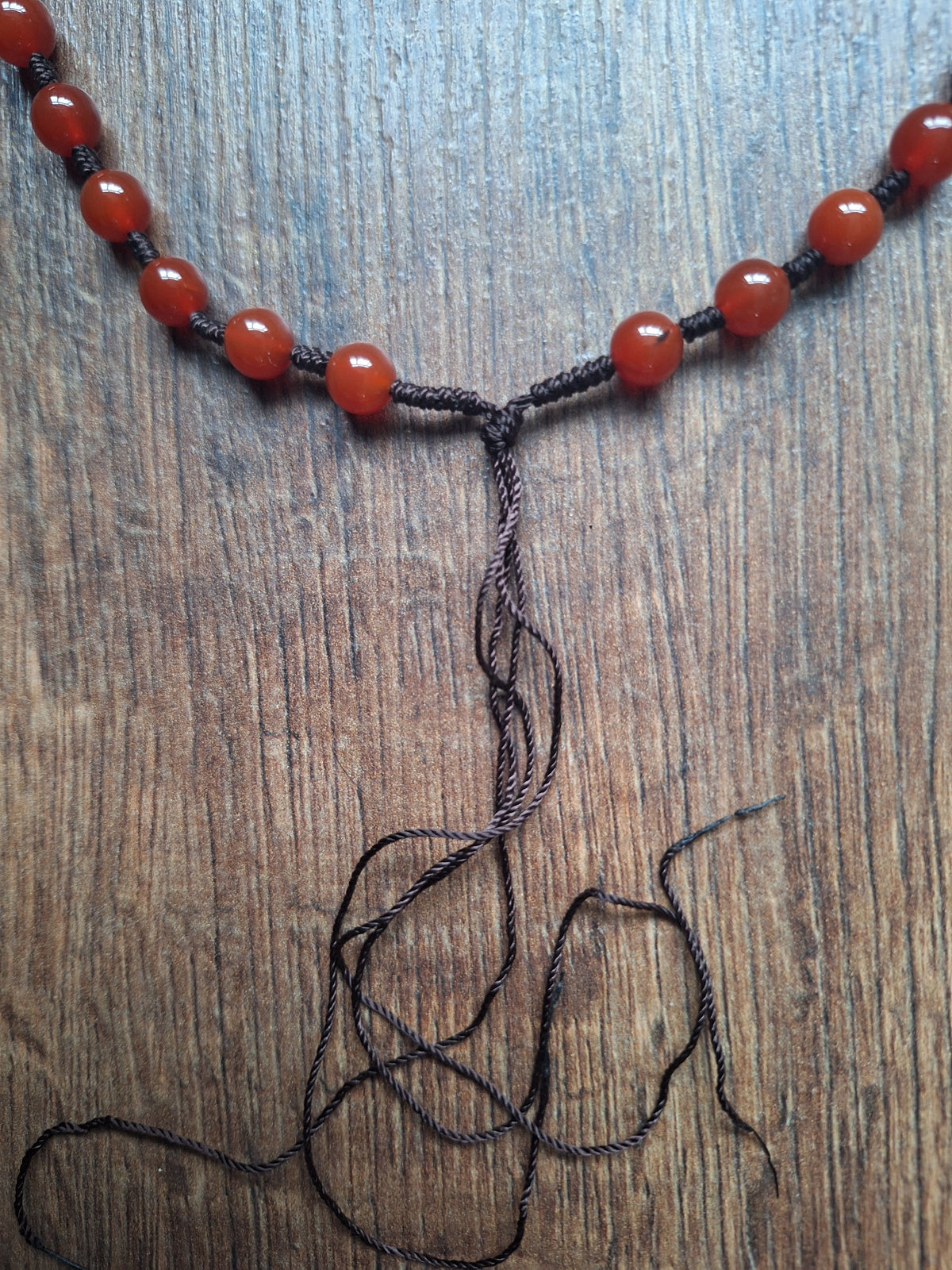 Amulet cord with carnelion beads