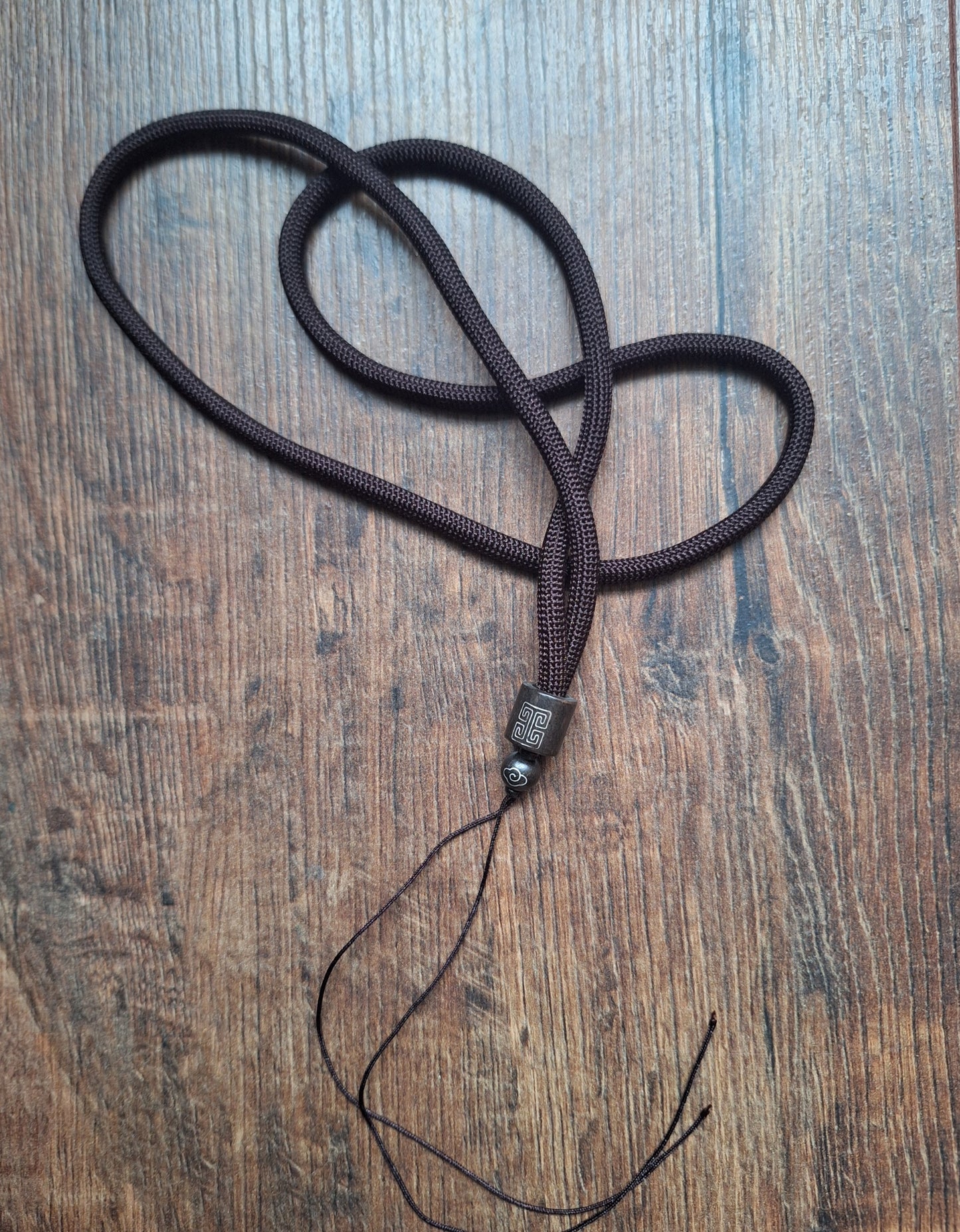 Amulet cord brown with shou symbol