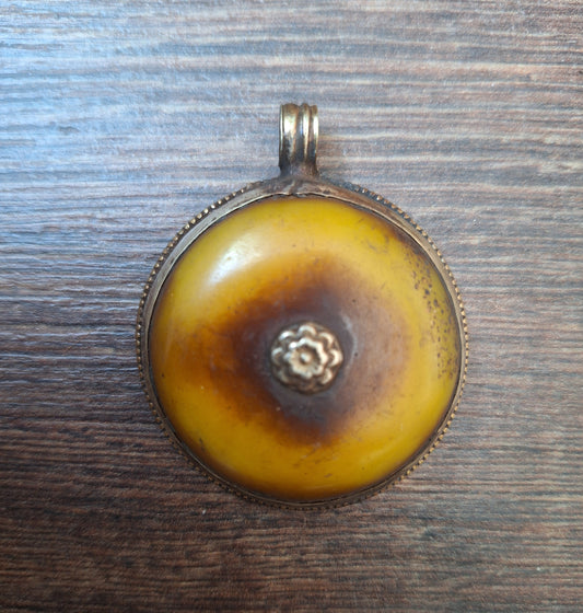 Vintage Tibetan silver and copal pendant