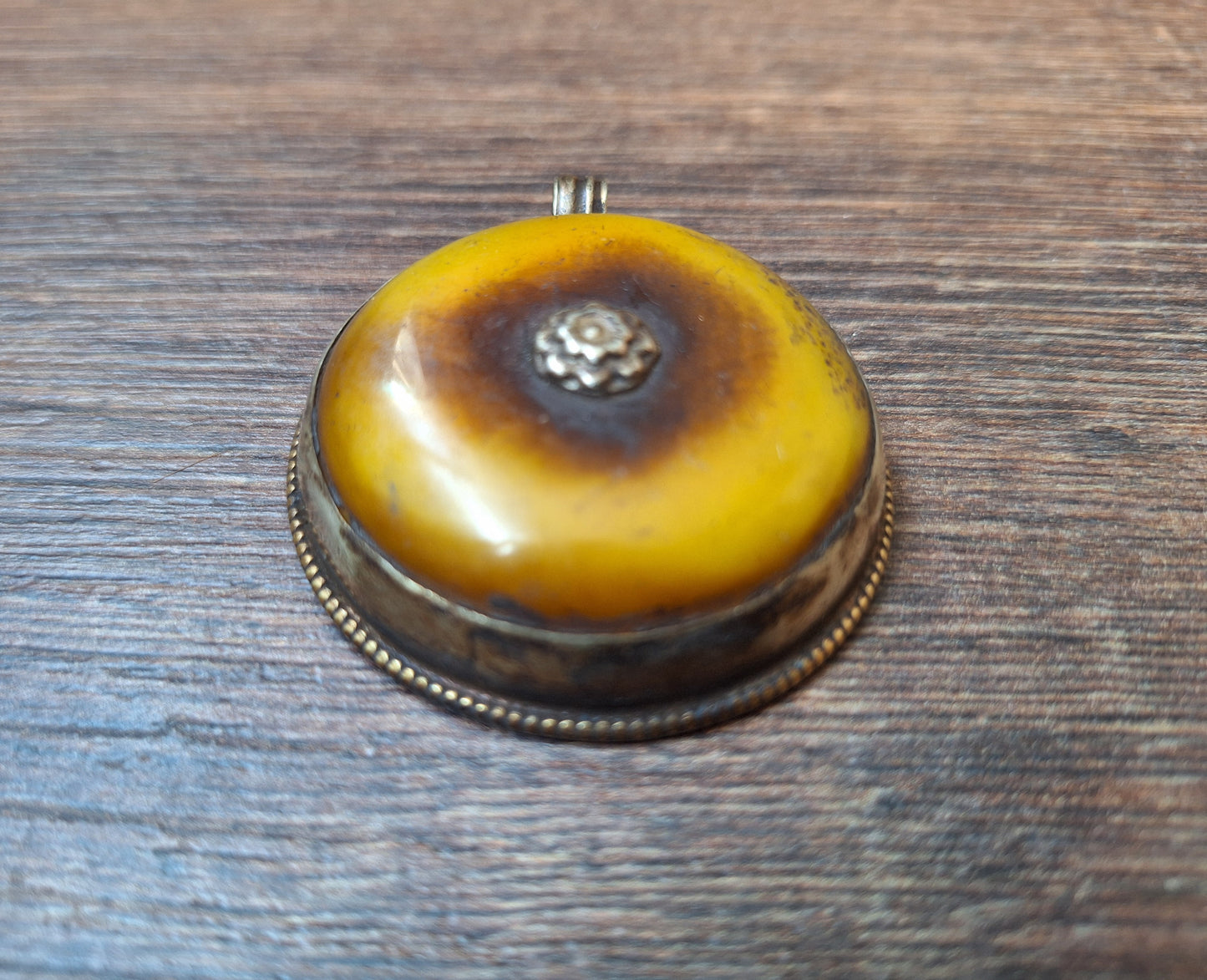 Vintage Tibetan silver and copal pendant