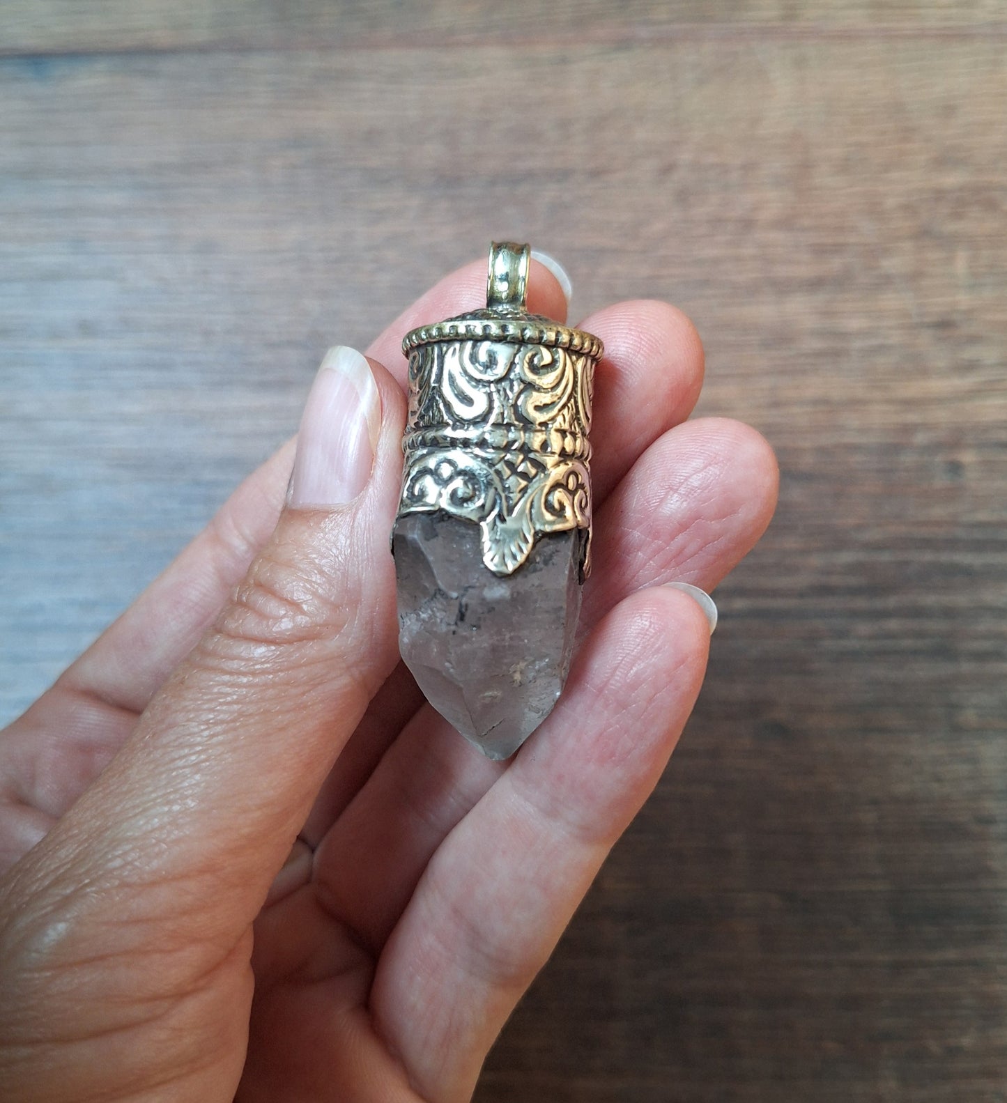 Vintage quartz crystal in Tibetan silver pendant