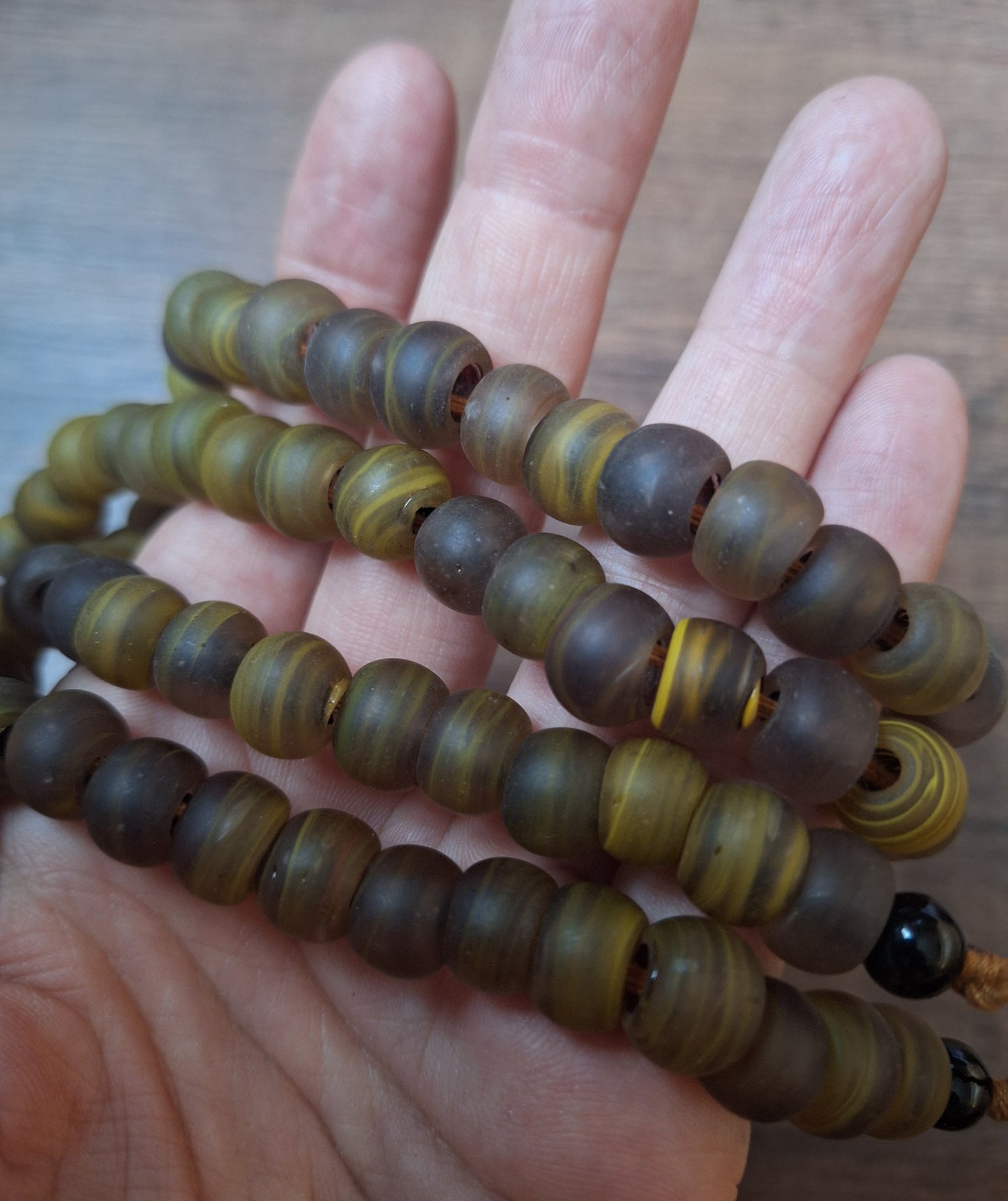 Vintage glass bead necklace with resin tiger tooth pendant