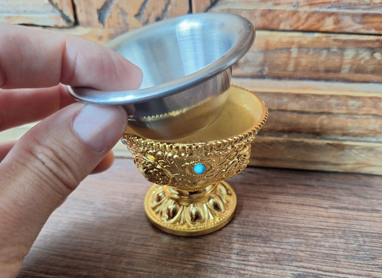 Gold coloured metal alloy offering bowl